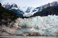 Juneau, Alaska, USA. The Margerie Glacier and Mount Fairweather in Glacier Bay National Park Alaska USA. Tarr inlet in Glacier Bay National Park. Margerie Glacier is a 21-mile-long (34 km) tide water glacier in Glacier Bay in Alaska and is part of the Glacier Bay National Park and Preserve. It begins on the south slope of Mount Root, at the Alaska-Canada border in the Fairweather Range, and flows southeast and northeast to Tarr Inlet. It was named for the famed French geographer and geologist Emmanuel de Margerie (1862–1953), who visited the Glacier Bay in 1913.