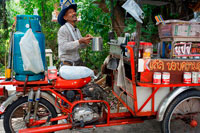 Bangkok. Bar caffe in a motorcycle. Preparing coffee and drinks. Ko Kret (also Koh Kred) is an island in the Chao Phraya River, 20 km north of Bangkok, Thailand. The island dates only to 1722, when a canal was constructed as a shortcut to bypass a bend in the Om Kret branch of the Chao Phraya river. As the canal was widened several times, the section cut off eventually became a separate island. The island continues to serve as a refuge to the Mon tribes who dominated central Thailand between the 6th and 10th centuries and have retained a distinct identity in their version of Buddhism and, particularly at Ko.