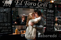 A couple kissing in front of “El Toro Grill” Restaurant in St George’s Market. The Markets area of Belfast used to have many different markets, including a pig market and a potato market. St Georges still has it's traditional fish, fruit and veg market every Friday (along with an assortment of other household items) and every Saturday there is a Farmer's Market. At the Farmer's Market you can buy locally grown produce, including ostrich and venison, and homebaked goods. There are also plants for sale.  In the run up to Christmas, there are several Craft Fairs. Each year these fairs get better and better and are an excellent outlet for buying local and Irish made products for gifts or special treats for yourself. There are people demonstrating their crafts such as ironmongers and woodworkers. There are also beautiful knits and hand sewn items. Admission is sometimes free and sometimes GBP2 which includes a cup of tea. There is even a kiddies table so the youngsters can be occupied. I am always impressed with the quality of the crafts that are on offer. 