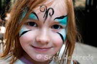 A child with painted face in St George’s Market. In addition to these local delicacies, there is also a fusion of tempting continental and speciality foods from around the world. Included are such delights as wild boar, cured meats, venison, Spanish tapas, Caribbean foods, Mexican and Slavonic foods, continental coffees and teas, Italian olive oils with traditional French Crepes and extraordinary French pastries to mention just a few. Added to this plethora of tempting foods the Saturday market also encompasses flower stalls ensuring this Saturday market is a kaleidoscope of colour.  St. Georges City Food & Garden Market is more than just a shopping experience. Customers can sample the produce, relax with a coffee and a newspaper against a backdrop of live jazz or flamenco music. This market is a real Saturday treat and a great outing for all the family. In a survey published by The Guardian newspaper's travel section in January 2010, St. George's Market came sixth in the UK ‘top ten’.**  Transport A free market bus runs every 20 minutes between the City Centre (outside Boots the Chemist, Donegall Place or HMV, Castle Place) and the market. Bus departs 8.00am on Friday and every 20 minutes thereafter. Bus departs 9.00am on Saturday and every 20 minutes thereafter.  Nearest customer parking at Hilton car park opposite the market. For more information on trading at St Georges market or hiring St Georges Market please visit http://www.belfastcity.gov.uk/stgeorgesmarket/index.asp  