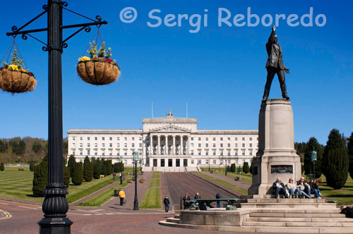 Statue Of Edward Carson In Front Of The Parliament Buildings, Belfast, Northern Ireland. The Parliament Buildings, known as Stormont because of its location in the Stormont area of Belfast is the seat of the Northern Ireland Assembly and the Northern Ireland Executive. It previously housed the old Parliament of Northern Ireland. The building was used for the Parliament of Northern Ireland until it was prorogued in 1972. The Senate chamber was used by the Royal Air Force as an operations room during World War II. The building was used for the short-lived Sunningdale power-sharing executive in 1974. Between 1973 and 1998 it served as the headquarters of the Northern Ireland civil service. Between 1982 and 1986 it served as the seat of the rolling-devolution assembly. It is now the home of the Northern Ireland Assembly. In the 1990s, Sinn Féin suggested that a new parliament building for Northern Ireland should be erected, saying that the building at Stormont was too controversial and too associated with unionist rule to be used by a power-sharing assembly. However, no-one else supported the demand and the new assembly and executive was installed there as its permanent home. On 3 December 2005, the Great Hall was used for the funeral service of former Northern Ireland and Manchester United footballer George Best. The building was selected for the funeral as it is in the only grounds in Belfast suitable to accommodate the large number of members of the public who wished to attend the funeral. Approximately 25,000 people gathered in the grounds, with thousands more lining the cortege route. It was the first time since World War II that the building has been used for a non-governmental or non-political purpose. In springtime in 2006 however the building was reopened for political talks between the MLA's from the various political parties in Northern Ireland. 