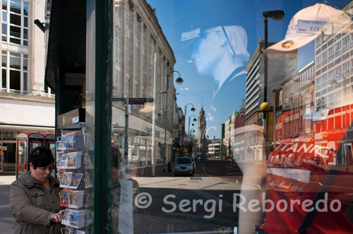 Reflections in a window of one of the shops in the center of Belfast. All the usual department stores and high-end chains are located on High Street and Royal Avenue, and the smaller streets connecting them. This area is mostly for pedestrians. The Castlecourt Shopping Centre is located on Royal Avenue and is Northern Ireland’s largest shopping mall, with more than 70 different shops. The Lisburn Road shopping centre houses trendy designer boutiques. For more individual, arty shops, explore the Cathedral Quarter, as well as Bedford Street, Dublin Road and Donegall Pass (the latter and interesting mix of biker  shops and antique markets) where you will find interesting design stores, antiques, gift shops and many other small Belfast outlets.   For arts and crafts, visit the Wicker Man in the Donegall Arcade. At the Workshops Collective (1a Lawrence Street), you can pick up paintings, sculpture, furniture and crafts directly from the artist.   Saint George’s Market, access via Oxford Street, is the last surviving covered Victorian market in Belfast and has been newly restored, giving it a new lease of life. On Fridays the food market runs from 07.00-15.00 and sells fresh fruit, vegetables, flowers and fish, as well as some miscellaneous items. 