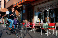 Berlin. Germany. Woman in bicycle in front of Chaos in form shop in Kreuzberg. Falkenstein Street near Oberbaum Bridge, Design Store, Club Scene, Kreuzberg, Berlin. The streets of east Kreuzberg are littered with cool boutiques, usually owned by, or stocking items from, local labels and designers. It’s not just clothes on offer: there are books, handmade crafts, second hand furniture and, of course, some good old fashioned vinyl. Wander around and you’ll undoubtedly come across little gems. Here are our favourite local shops for unique shopping in Kreuzberg: Chaos in form. Designed by architect of the moment, is 300 square metres of post-industrial minimalist shopping heaven. Formerly a locksmiths’ workshop, the space is full of chic bare wood and lonely looking rails that house high quality clothes and accessories from street to high fashion.
