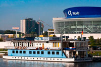 Berlin. Germany. Berlin O2 World Spree Hostel Eastern Comfort. The hostel boats 'Eastern Comfort & Western Comfort', looks forward to welcoming you onboard with its unusual atmosphere which is unique to Berlin!  The 'Eastern Comfort' is composed with 1st and 2nd class cabins all of them ensuite. Choose between the spacious 1st class cabins, with large windows, natural lighting and thus spectacular views of the Berlin Wall or the river Spree. Minibar and Tv available on request. Or view Berlin through the portholes of our 2nd class cabins, smaller but cosy. Also equipped with 3 and 4 beds.