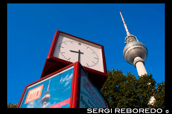 Television tower and world clock at Alexanderplatz in Berlin. Everyone is supposed to remember that Berlin’s Fernsehturm (TV Tower) is 365m high and is the tallest building in Berlin. As urban legend has it, the tower’s height was a deliberate decision taken by Walter Ulbricht, Leader of the SED, so that every child would be able to remember it, just like the days of the year. In fact the tower’s summit today is 368m.  Construction for the GDR transmitter started in the 1950s and the tower erected between 1965-69 was intended as the tallest tower in Europe second only to Moscow’s own TV tower. It was built by East German architects Fritz Dieter, Günter Franke and Werner Ahrendt.  A separate TV broadcasting system for East Berlin was a necessity during the years of division and the fact that it was built right in the middle of the city was Ulbricht’s original vision. It remains the only city TV tower in Europe. An extremely popular sight for tourists and Berliners alike, it currently receives over 1 million visitors a year. The lift reaches an altitude of 200m in 40 seconds; the observation deck is at a height of 203m and the Telecafé at 207m. The Telecafé, designed with an outer ring of revolving tables, serves coffee, snacks and reasonably priced meals while revolving once around its axis every 30 minutes. On a bright day, this is the way to take in Berlin and surrounding Brandenburg from an eagle-eyed view.