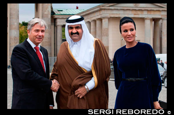 Berlin Major Klaus Wowereit (C), accompanies the Emir of Qatar, Hamad bin Khalifa Al Thani (L), and his wife Mozah Binti Nasser Al Missned (R), to the landmark Brandenburg Gate in Berlin, Germany. Qatar celebrates its National Day in commemoration of the historic day in 1878 when Shaikh Jasim succeeded his father, Shaikh Muhammad Bin Thani, as a ruler and led the country towards unity. The event on December 18 is considered as an opportunity for all Qatari nationals and expatriates to recognise and celebrate what it means to live in modem day Qatar.  Qatar is a peninsula of 11.521 sq km located half way down the west coast of the Arabian Gulf enveloped by water from almost all sides. The country is centrally placed among the states of the Gulf Cooperation Council (GCC). It is neighboured by Saudi Arabia and UAE from the south and by Bahrain from the north-west. Qatar is considered as an ideal gate to the Arabian Gulf due to its unique historical monuments and its beautiful scenery, in addition to the high quality architecture, sports, shopping, restaurants and living compartments.  The state of Qatar with a population of 1,677,045, is a land of astonishing natural beauty and cultural prosperity, it is considered to have some of the most beautiful landscape in the Arabian Peninsula. The country's geographic location had a major influence on its politics, strategic options and development. Although the country is small in size yet it is big in value, it has achieved in decades what takes centuries for other countries to achieve. Its citizens hold an optimistic future and potentials that others can only envy. Qatar's history extends to more than four thousand years; it tells stories of heroism, great courage, wisdom, patriotism, love and devotion to homeland. This brings closer understanding to the richness of the Qatari cultural experience, which has contributed, to the building of modern Qatar.  Since His Highness Sheikh Hamad Bin Khalifa Al-Thani ascended the throne in 1995, the country has achieved high level of economic growth and development. It enjoys a strong and firm economy, helped by its vast oil and natural gas reserves, which forms the mainstay of the Qatar economy. Even though total oil reserves are somewhat modest in comparison to other Arabian Gulf countries, Qatar is one of the leading natural-gas producers in the world. It produces natural gas, crude oil, refined petroleum, and petrochemicals, in addition to steel, cement, and fertilisers.  Qatar has become an important centre for global companies and agencies, which started opening branches in Qatar due to its unique and profitable location to invest, and market products, therefore it can be said that Qatar has become a key player in the business world, especially in the Gulf region. Qatar's government and people are also working hard in diversifying its economy away from oil and gas, and there has been strong growth in tourism, IT and the knowledge-based economy in recent years, and despite the implications of the global financial crisis, the economic performance of the state of Qatar has been a source of appreciations by a number of financial institutions all over the world. Education and health sectors have played and still playing an important role in building the Qatar citizens. The number of schools avails high quality health and education care free of charge to all Qataris. Qatar's education infrastructure has grown dramatically in recent years thanks to the country's rapid economic growth. In addition, Qatar has high quality health care system, which won the praise of Unicef and WHO.  Qatar is fast developing as a major Mid-east destination, after opening its doors to tourism. It houses major historic forts, modem luxury hotels, and impressive seascapes. Tourists can explore the natural environment of Qatar by taking an exciting desert safari. There is something for everyone in this land of great natural beauty. As for sports, being recently chosen by the FIFA to host the 2022 World Cup, Qatar becomes the first ever Muslim and Arab country to host the world's greatest football event. The decision shows that the Arab countries are capable of organising major international events and serves as an opportunity to promote and portray the accurate image of the Islamic culture. It is also a glorious chance for the Arab football teams to make their presence felt in the tournament. On the other hand, Qatar plans to achieve another impressive success when it hosts the 2011 AFC Asian Cup, after the resounding success of the XV Asian Games 2006 in Doha. 