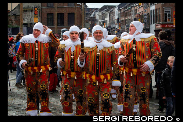 Belgium, carnaval of Binche. UNESCO World Heritage Parade Festival. Belgium, Walloon Municipality, province of Hainaut, village of Binche. The carnival of Binche is an event that takes place each year in the Belgian town of Binche during the Sunday, Monday, and Tuesday preceding Ash Wednesday. The carnival is the best known of several that take place in Belgium at the same time and has been proclaimed as a Masterpiece of the Oral and Intangible Heritage of Humanity listed by UNESCO. Its history dates back to approximately the 14th century. Events related to the carnival begin up to seven weeks prior to the primary celebrations. Street performances and public displays traditionally occur on the Sundays approaching Ash Wednesday, consisting of prescribed musical acts, dancing, and marching. Large numbers of Binche's inhabitants spend the Sunday directly prior to Ash Wednesday in costume. The centrepiece of the carnival's proceedings are clown-like performers known as Gilles. Appearing, for the most part, on Shrove Tuesday, the Gilles are characterised by their vibrant dress, wax masks and wooden footwear. They number up to 1,000 at any given time, range in age from 3 to 60 years old, and are customarily male. The honour of being a Gille at the carnival is something that is aspired to by local men