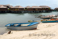 The inhabitants of the island of Mabul, sea gypsies, share their territory with some hotels for divers.