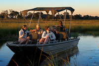 Tourists enjoying the last rays of sun on the water safari camp made from Eagle Island Camp by Orient Express, outside the Moremi Game Reserve in Botswana. The Okavango River originates in Angola and after traveling almost 1000 kms is divided into countless streams, canals and lakes forming the Okavango Delta area called (as in Botswana). Occupies 15,000 square kilometers this amazing gift of nature full of birds of all colors, hippos, crocodiles, impalas, zebras, elephants, buffalo, wild boars ... and water lilies, papyrus and more varied fauna. The safaris are made on foot or by boat. Also consider visiting villages where humble life of its inhabitants: wooden houses sharing a water fountain without light. Where moroko Besides taking tourists, their sources of income are small gardens, fishing and handicrafts. RECOMMENDATIONS If you want to see are large mammals, the best time to visit the delta is from May to October, when the water is low. If you prefer green vegetation cover angry birds is the best time of the rainy season from November to April. The apartments in the heart of the delta are private and are very expensive. The alternative is the camps and government lodges found in the peninsula of Moremi.