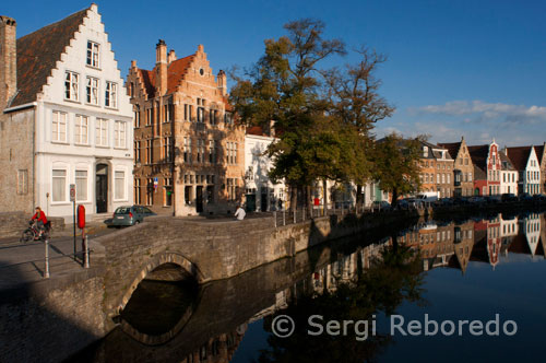Bruges landscapes. Houses on Langerei street refelected in canal. 