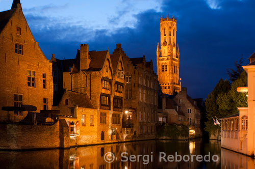 Bruges at night with the Belfry in the background, the most tipical landscape in Bruges. Evening view over Bruges : the Dijver canal and the Belfry tower.