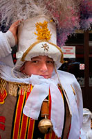 A child dressed in the typical costume of Binche. The Belgian festival Binche with their traditional costumes: Eastern princes, sailors and harlequins. An amazing procession through the cobbled streets of the city to the beat of drums and artists with their wax masks and ostrich feathers. Quite an experience.