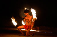Aitutaki. Cook Island. Polynesia. South Pacific Ocean. A child plays typical fire dances of the Polynesian in the Aitutaki Lagoon Resort & Spa Hotel. Daily Activities Programme. Time and time again our guests remark on how much their holiday has been enriched by the warmth, friendliness, sense of fun and depth of local knowledge shared freely with them by our Activities Team members. And this too is often why they return, time and again, to The Rarotongan rather than stay at an isolated bach. Because here at The Rarotongan, you can enjoy one of the most extensive free activities programmes you are likely to find anywhere on Earth.  It’s all laid on, right here at The Rarotongan. Resort Orientation – others include this as a bonus offer (!!), here at The Rarotongan, it’s a given … Snorkelling Lessons in the Pool or Lagoon – great for when you’re a bit rusty, or haven’t had a go before. Very patient, sympathetic instructors.  	 Snorkelling Safaris in pristine Aroa Lagoon Marine Reserve – it’s good to go with a knowledgeable guide, then use our Snorkelling Map another time and do it your way (yip, we even publish an Aroa Lagoon Snorkelling Map – only at The Rarotongan!) Night Snorkelling – unique to The Rarotongan, and one of our most popular and fascinating excursions Fish Feeding – this is one of the absolute highlights for so many guests, young and young at heart! The fish are the friendliest you’ll fine anywhere Guided Kayaking Safaris – drink in some great views of the majestic mountains from Aroa Lagoon Guided Nature & Village Walks – The Rarotongan is located in beautiful Aroa, between Rutaki and Kavera villages, well away from any other resorts or hotels.  