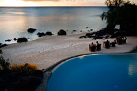 Aitutaki. Cook Island. Polynesia. South Pacific Ocean.  Seaside swimming pool at the Hotel Pacific Resort Aitutaki. Pacific Resort Aitutaki welcomes you to one of the world’s most secluded boutique island resorts offering luxurious Aitutaki hotel accommodation. Surrounded by the crystal clear turquoise waters of Aitutaki lagoon, the idyllic atoll of Aitutaki is a magical destination. Explore the sights. Enjoy the sophistication of delicious cuisine, attentive high quality service and modern resort facilities. Discover true relaxation. With just 27 luxurious beachfront suites, villas, premium bungalows and ultimate bungalows all situated within steps of the Pacific Ocean, Pacific Resort Aitutaki is secluded and peaceful. Pacific Resort Aitutaki is an award winning resort, winning “World’s Leading Boutique Island Resort” in the World Travel Awards of 2008, 2009 and 2010. We are the Cook Islands’ only member of the Small Luxury Hotels of the World collection. Pacific Resort Hotel Group dominates at 20th Annual World Travel Awards Pacific Resort Hotel Group is once again proud to announce that Pacific Resort Aitutaki has dominated at the Asia & Australasia regional ceremony for the 2013 World Travel Awards, capturing three major titles, also qualifying the 5 star boutique resort as finalists for the "World's Leading" cate..