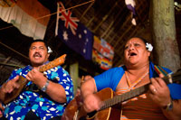 Atiu Island. Cook Island. Polynesia. South Pacific Ocean. Dances and Polynesian dances organized at Hotel Villas Atiu Atiu island.  The music of the Cook Islands is diverse. Christian music is extremely popular. Imene tuki is a form of unaccompanied vocal music known for a uniquely Polynesian drop in pitch at the end of the phrases, as well as staccato rhythmic outbursts of nonsensical syllables (tuki). The word 'imene' is derived from the English word 'hymn' (see Tahitian: 'himene' - Tahiti was first colonised by the English). Likewise the harmonies and tune characteristics / 'strophe patterns' of much of the music of Polynesia is western in style and derived originally from missionary influence via hymns and other church music. One unique quality of Polynesian music (it has become almost a cliché) is the use of the sustained 6th chord in vocal music, though typically the 6th chord is not used in religious music. Traditional songs and hymns are referred to as imene metua (lit. hymn of the parent/ancestor).