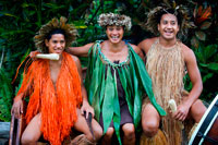 Rarotonga Island. Cook Island. Polynesia. South Pacific Ocean. Highland Paradise Cultural Village. Some of the actors of Highland Paradise Cultural Village with polynesian dress. The unique Cook Islands culture is continually evolving and today you can discover it as it was in pre-missionary times. This tour is the perfect way to view the island and get an insight into the sacred rites and traditions of the forefathers of Rarotongans. Highland Paradise is a traditional Marae situated 509 metres above sea level and boasts approximately 205 acres of beautiful transcending gardens and panoramic views of the aqua lagoon, fringing coral reef and Pacific Ocean. This breathtaking site has been a haven for families, warriors and chiefs for centuries. The ‘Are Kario’, or Hall of Cultural Entertainment, has been designed to take advantage of the spectacular views and to offer shelter as you enjoy some of Rarotonga’s top entertainment! The show’s sensuous dancing and pounding drums are typical of the island and considered to be amongst the best in the South Seas. 