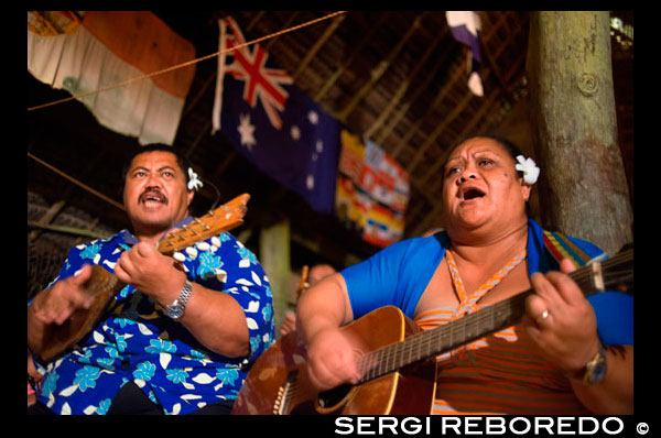 Atiu Island. Cook Island. Polynesia. South Pacific Ocean. Dances and Polynesian dances organized at Hotel Villas Atiu Atiu island.  The music of the Cook Islands is diverse. Christian music is extremely popular. Imene tuki is a form of unaccompanied vocal music known for a uniquely Polynesian drop in pitch at the end of the phrases, as well as staccato rhythmic outbursts of nonsensical syllables (tuki). The word 'imene' is derived from the English word 'hymn' (see Tahitian: 'himene' - Tahiti was first colonised by the English). Likewise the harmonies and tune characteristics / 'strophe patterns' of much of the music of Polynesia is western in style and derived originally from missionary influence via hymns and other church music. One unique quality of Polynesian music (it has become almost a cliché) is the use of the sustained 6th chord in vocal music, though typically the 6th chord is not used in religious music. Traditional songs and hymns are referred to as imene metua (lit. hymn of the parent/ancestor). Traditional dance is the most prominent art form of the Cook Islands. Each island has its own unique dances that are taught to all children, and each island is home to several annual competitions. Traditional dances are generally accompanied by the drumming of the pate. The Cook Islands drumming style is well-known internationally, but is often misidentified as an example of Tahitian music. This is most uncommon as the Cook Islands have a strong connection to their Tahitian ancestry. Harmony-singing church music and a wide variety of hymns and wedding and funeral music are found throughout the Cook Islands. There is much variation across the region, and each island has its own traditional songs. 