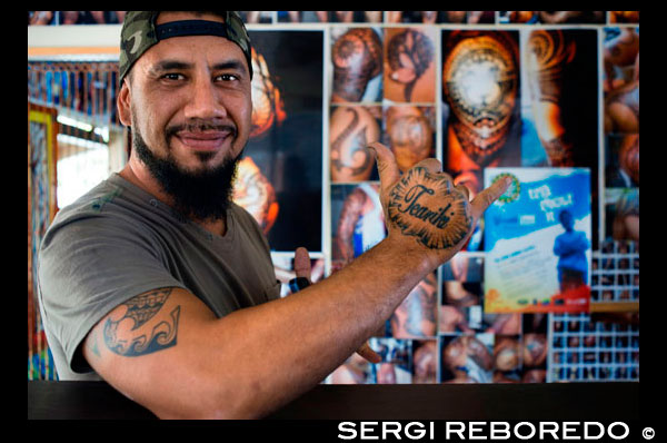 Rarotonga Island. Cook Island. Polynesia. Tattooist. One of the places where we can get a tattoo in the Cook Island is in the Punanga Nui Markets. Clive Nicholas is a talented and gifted tattoo artist like many others who have the natural flair and creativity of Polynesian Art.  Clive is of Cook Islands, Samoan, Tahitian and NZ Maori decent which his family acknowledges and is very proud of. Clive was born on the beautiful Island of Rarotonga and raised in the land of the long white clouds of Aotearoa in the mean streets of Otara. Clive was brought back to the islands by his parents at the age of 9 and attended the only Catholic Schools on the island St Joseph’s primary and Nukutere College. Clive has a very strong faith in Christ and only works weekdays and Saturday. Balance is a major factor for Clive. He has to juggle between family, work, sports and family. God and family is what he lives by and tattooing is his passion.  Clives introduction into the art of tattooing came from his brother Boye who is a well known tattooist around the Pacific and owned his own tattoo shop Polynesian Tattoos. After a couple of months as an apprentice for Boye, he acquired the skills and art of tattooing and was thrown into his own space. This is where he began working on his own clients, designing and creating tattoos, of course under the watchful eye of Boye. Clives introduction into the art of tattooing came from his brother Boye who is a well known tattooist around the Pacific and owned his own tattoo shop Polynesian Tattoos. After a couple of months as an apprentice for Boye, he acquired the skills and art of tattooing and was thrown into his own space. This is where he began working on his own clients, designing and creating tattoos, of course under the watchful eye of Boye. At the end of 2010, Clive took on a much larger responsibility and challenge by starting up his own shop in a batch behind his family home in town.  It was much harder for Clive especially because he came from working with his brother, running a well established shop, to starting one from scratch. Clive holds very high standards in terms of quality of tattooing and designs. He has had the privilege of inking some very well known athletes with the likes of Rene Ranger (All Blacks), Tomasi Cama and Zar Lawrence  He has also tattooed a K1 world champ Mark Hunt who has inspired Clive though out his upbringing. Having the opportunity to display his talent on these prestigious athletes has given Clive a desire to strive for higher goals and has given him a sense of pride and belief that anything is possible if you are passionate about it and if you put your mind.
