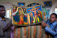 Some priests show the sacred books of the new church of St Mary of Zion in Axum. The Ethiopian churches have several inputs: the south entrance for women and for men the north, the east can be used interchangeably. Built following a scheme inspired by the Temple of Solomon, have three parts: a choir, a sacred space where the Eucharist is distributed and a closed sanctuary accessible only to the priests. There, in that part called "holy of holies", every church keeps a Tabot, a replica of the Ark and its Tables of the Law, in a small wooden box.