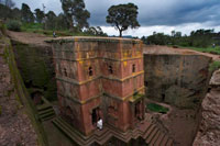 Lalibela. Church of St. George. The Church of St. George is the best preserved of all Orthodox temples carved in stone of Lalibela, Ethiopia. This reservoir rock, which has its origins in medieval times, was built as a representation of the Holy Land by Zague Dynasty. Currently, the Temples of Lalibela continue their religious activity and are visited by pilgrims who are confused with curious tourists discover the network of passages between rocks that bind to each other.