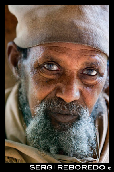 Portrait of an old man in Kebran Gabriel Monastery on Lake Tana. Kebran Gabriel, the monastery near Bahar Dar, is a major tourist attraction for male visitors, as it is one of the places where women are banned. Originally established in the fourteenth century and rebuilt during the reign of Emperor Iyasy me, is a modest building, but with a different impressive cathedral. Ura Kidane Mehret is populair another attraction that is open to women. Located on the peninsula of Zeghe, the design of the monastery dates from the same period as that of the one at Kebran Gabriel, but a building is more decorative, arched over with huge wooden ceiling and frescoed inside full color depicting scenes of biblical tradition and history of the Ethiopian Orthodox Church.
