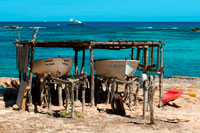 Formentera. Els Pujols beach in Formentera with traditional fishing boat in summer day. Llaüt.