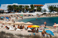 Formentera. Es Pujols, beach, panoramic view, parasol, deck chair, tourism, holiday. Spain, Balearic Islands, south of Ibiza island, Formentera island, Es Pujols beach.