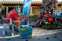 Formentera. Hippy craftsman and painter in the Hippy Market, Pilar de la Mola, Formentera, Balearic Islands, Spain, Europe