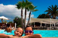 Formentera. Gecko luxury boutique Hotel, Migjorn beach, Formentera Island, Balearic Islands, Spain, Europe. Girls in the swimming pool.