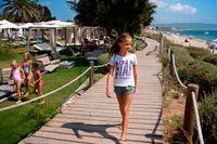 Formentera. Girls and children in the Gecko luxury boutique Hotel, Migjorn beach, Formentera Island, Balearic Islands, Spain, Europe. 