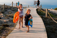 Formentera. Sa Roqueta Beach and Ses Illetes Beach, Balearic Islands, Formentera, Spain. Funy girls with floats.