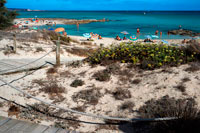 Formentera. Ses platgetes beach in Es Calo de San Agusti, Formentera Island, Mediterranean sea, Balearic Islands, Spain. Can Rafalet Restaurant. Es Calo de San Agusti with boat in Formentera island turquoise mediterranean. 