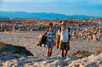 Formentera. Sa Roqueta Beach and Ses Illetes Beach, Balearic Islands, Formentera, Spain. Couple walking in the sand. 