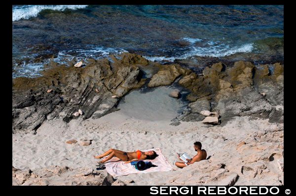 Read and relax in Es caló des Mort beach, Migjorn beach, Formentera, Balears Islands, Spain. Holiday makers, tourists, Es caló des Mort, beach, Formentera, Pityuses, Balearic Islands, Spain, Europe. Spain; Formentera; Migjorn; beach; read; reading; relax; relaxing; island; balearic; mitjorn; couple; es calo; calo; des mort; des; morts; swim; swimming; Baleares; atrraction; destination; Europe; sand; mitjorn; European; holiday; travel; islands; blue; turquoise; mediterranean; photos; place; spanish; sun; beaches; break; calm; clear; coast; color; colour; dawn; day; daybreak; destination; dune; early; flat; formentera; holiday; horizon; horizontal; island; islas; landscape; mediterranean; migjorn; mist; bodies; body; busy; coast; coastline; coastlines; coasts; crowded; day; daylight; daytime; de; during; europe; european; outside; morning; pitiuses; sandy; scene; sea; south; spain; summer; vacation; view; wave; waves; tourism; touristic; vacation; view; Balearics; beautiful; beauty; paradise; fun; happy; coastal; paradisiac; popular