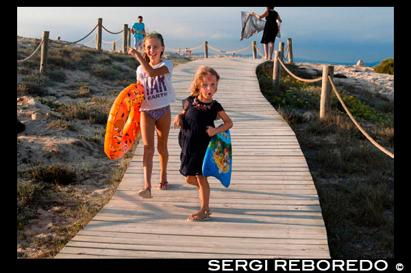 Sa Roqueta Beach and Ses Illetes Beach, Balearic Islands, Formentera, Spain. Funy girls with floats. Spain; Formentera; island; Ses Illetes; beach; sa roqueta; illetes; roqueta; coastline; marine; scene; outdors; girls; children; floats; waterwings; surf; smile; sand; summer; balearic; nice; sea; boats; pretty; beauty; calo; beach; beautiful; beauty; blue; coast; europe; holiday; idyllic; isla; island; islands; islet; landmark; landscape; mediterranean; nature; ocean; outdoor; paradise; places; rock; rocky; san; scenic; sea; seascape; shallow; shore; sky; spain; stones; holiday; horizon; islands; length; look; med; mediterranean europe; platge; platja; playa; rear; rocks; rocky; rough; sand; sandy; sea; single; slim; spain; spanish; stand; summer; tourism; travel; vacation; view; watch; wave; sun; sunny; touristic; transparent; travel; turquoise; vacation; water; waves; white; balearic; Baleares; atrraction; destination; Europe; European; holiday; travel; islands; mediterranean; photos; place; spanish; sun; tourism; touristic; vacation; view; Balearics; beautiful; beauty; paradise; fun; happy; coastal; paradisiac; popular