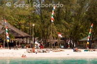 Hotels on the beach near the pier of the eastern part of the island of Gili Meno.