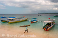 Some boats on the shore of the beach at the east of the island, where most hotels coalesce. Gili Meno.