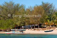 Hotels on the beach near the pier of the eastern part of the island of Gili Meno.