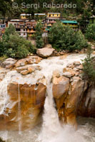 Gangotri is a very nice town and is fairly popular with foreigners; many who have come to make the trek to Gaumukh; or further. Unlike most of the other towns on the Char Dham route; it is a nice place to stay for a while. The Bhagirathi River rushes by and is extremely loud; giving the place a peaceful atmosphere. Gangotri is located about 250km from Rishikesh and 230km from Yamunotri. The bus trip via Tehri and Uttarkashi from Rishikesh takes 10 to 12 hours. At Gangotri the Kedar Ganga River merges with the Bhagirathi River at Dev Ghat; which is next to the main bridge; on the other side of the river from the temple. There is a falls called Sahasradhara about 100m below this confluence. Just before the falls the river squeezes itself into a narrow gorge about one metre wide. The actual source of the Ganges is Gaumukh; a hard 19km climb from Gangotri. Bhagiratha is said to have prayed at Gangotri to save his relatives. The Pandavas are said to have visited this place to atone for the sin of killing their relatives during the Kurukshetra war. At this point the Ganges River flows north; giving this village its name; Gangotri; which means “Ganga turned north.” Lord Krishna says in Bhagavad-gita; Of flowing rivers I am the Ganges. 