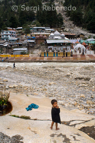 INDIA CROSSING THE RIVER GANGES Gangotri is the origin of River Ganga and one of the four sites in the Chardham Yatra. Here; Ganga is known as Bhagirathi; named after the ancient king Bhagirath; who performed penance to bring her down from the heavens. It is believed that bathing in her waters brings deliverance from sins committed in the present and past births. Onwards Devprayag It acquires the name GANGA where Bhagirathi meets the Alaknanda. This temple was made with white stone by Amar Singh Thapa; Gorkha captain in the early 18th century . After Diwali the door of the temple are closed & reopened in May. During winters when Temple is closed due to the heavy snow fall; the idol of the Goddess is kept at Village Mukhab village near Harsil. The actual source of Holy river Ganga is at Gaumukh; set in the Gangotri Glaciers and is a 19 Kms trek from Gangotri. According to Hindu mythology; Goddess Ganga – the daughter of heaven; took the form of a river to absolve the sins of King Bhagirath’s predecessors; following his severe penance of several centuries. Lord Shiva received Ganga into his matted locks to minimize the impact of her fall. According to legend; a Suryavanshi king Sagar decided to perform the Ashwamedh Yagna (horse sacrifice). His 60; 000 sons conquered the territories that the horse crossed. Indra felt threatened by their success. He stole the horse and tied it in Kapil Muni’s ashram. Sagar’s sons followed the horse into the ashram and were disrespectful to the seer; who cursed them. All 60; 000 of them were turned into ashes. The king beseeched the seer for forgiveness; but the curse could not be reversed. However; Kapil Muni suggested that if the holy Ganga; the river of heaven; were to come down to the earth; the touch of her waters would ensure the deliverance of the princes. Many descendants of Sagar failed in their efforts to bring the holy Ganga to earth; until Bhagirath was born. He persevered in his prayers until Ganga agreed to come down to the earth from the heavens. But such was her power that her descent was sure to cause havoc. Thus Bha¬gi¬rath prayed to Lord Shiva; who agreed to contain Ganga in his locks; from where he released a few drops of her celes¬tial waters. The river thus flowed on earth; cleansing all that was impure in her path and delivering the sons of Sagar from their curse.