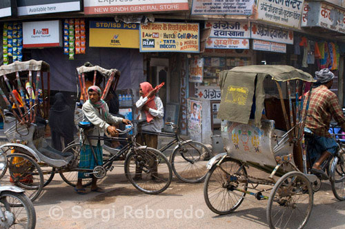 INDIA CROSSING THE RIVER GANGES Varanasi or Benares - cycle-rickshaws dominate the streets in the city center. Varanasi; the holy city of India; is also known by the name of Kashi and Benaras. Kashi; the city of Moksha for Hindus since centuries; is known for its fine-quality silks; 'paan' and Benares Hindu University and Avimukta of the ancient days; Varanasi is the most popular pilgrimage point for the Hindus. One of the seven holiest cities; Varanasi city is also one the Shakti Peethas and one of the twelve Jyotir Linga sites in India. In Hinduism it is believed that those who die and are cremated here get an instant gateway to liberation from the cycle of births and re-births. Considered as the abode of Lord Shiva; Varanasi is situated on the banks of River Ganges; which is believed to have the power of washing away all of one's sins. As pundits here will tell you; whatever is sacrificed and chanted here or given in charity reaps its fruits thousand times more than those good deeds performed at other places because of the power of that place. It is believed that three nights of fasting in Varanasi city can reap you rewards of many thousands of lifetimes of asceticism! Varanasi is the oldest city of the world. Varanasi is more than 3000 years old and is famous as the city of temples. In Varanasi; there are temples at every few paces. Looking at the number of temples in Varanasi; it is hard to believe that a large number of them were demolished during the medieval times. Jyotirlinga Visvanatha Temple or Golden Temple; rebuilt in 1776; is dedicated to Lord Shiva. The Jnana Vapi well (meaning 'Well of Wisdom) is believed to have been dug by Lord Shiva himself. It is believed that the majestic Alamgir mosque has replaced one of the most ancient shrines known as the temple of Bindu Madhava. The thirty-three hundred million shrines fill one with awe and wonder with sheer numbers. The Ganga Ghats (river front) are the most popular pilgrimage spot of Varanasi and are centers of music and learning. There is a great tradition of Yatras in the holy city of Kashi and the most sacred path is that of Panchkoshi Parikrama; the fifty-mile path with a radius of five miles that cover 108 shrines along the way; with Panchakoshi Temple as its main shrine. Other popular pilgrimage route is Nagara Pradakshina; which covers seventy-two shrines along the way. Since time immemorial Varanasi is a great center of learning. The holy city has been a symbol of spiritualism; philosophy and mysticism for thousands of years and has produced great saints and personalities like Guatama Buddha; Mahavira; Kabir; Tulsi Das; Shankaracharaya; Ramanuja and Patanjali.