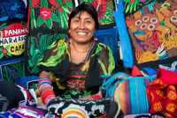 Kuna women sell their molas to the tourists. Panama City Casco Viejo kuna indian traditional handicraft items sellers by kuna tribe.  Old Quarter, Panama City, Republic of Panama, Central America. In Balboa, on Avenida Arnulfo Arias Madrid and Amador, is a small YMCA Handicrafts Market, with mostly Kuna and Emberá indigenous arts and crafts, and clothing. Old Artesanal YMCA