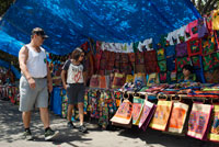 Kuna women sell their molas to the tourists. Panama City Casco Viejo kuna indian traditional handicraft items sellers by kuna tribe.  Old Quarter, Panama City, Republic of Panama, Central America. In Balboa, on Avenida Arnulfo Arias Madrid and Amador, is a small YMCA Handicrafts Market, with mostly Kuna and Emberá indigenous arts and crafts, and clothing. Old Artesanal YMCA Go for: native handicrafts, molas bags, shirts, glasses cases, and pot holders, embroidered blouses, jewellery