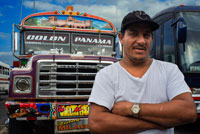 Driver of BUS RED DEVIL DIABLO ROJO PAINTED BUS PANAMA CITY REPUBLIC OF PANAMA. Albrok bus station terminal. Panama. Here comes the Diablo Rojo, the Red Devil bus blasting its air horn and fishtailing around a fellow “demon” just in time to claim Irma Betancourt and other morning commuters. Suffice it to say the Red Devils earn their name. “They are crazy,” said Ms. Betancourt, 33, a housekeeper at a downtown hotel, boarding on a main boulevard. “We all know that. All they care about is getting the fare. So many times we have almost hit somebody.”