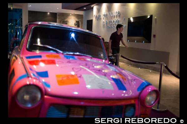Pink car at lobby of HARD ROCK HOTEL PANAMA MEGAPOLIS. In the heart of Panama rises the new Hard Rock Hotel Panama Megapolis. This spectacular sixty-six story tower beckons you to come and experience where rock star service meets urban chic design – all infused with the passion and irreverence of rock ‘n’ roll. Located just a few miles from the Panama Canal, this Hard Rock Hotel puts you center stage with breathtaking panoramic views of the city and the Panama Bay.  Live like a true rock star in one of our 1,463 stylish rooms and suites, then come experience our eleven exciting bars, four tantalizing restaurants, and our stellar nightclub. Relax in our Rock Spa, soak in the sun at our infinity pool cabanas, or take fun to new heights at our outdoor rooftop lounge. The hotel is just steps away from MultiCentro Mall and Majestic Casino, offering amazing shopping, restaurants, bars, convention center, and Movie Theater.  Latin America's hottest destination just got hotter with the unveiling of the eagerly anticipated Hard Rock Hotel Panama Megapolis. Located in the heart of Panama City, this awe-inspiring 66 story tower encapsulates the true rock star experience with luxurious touches that will leave you wanting more. Enjoy the decadence of 1,500 stylish rooms and suites, experience tantalizing nightlife and dining options, or turn up the volume poolside with breathtaking views of the city and Panama Bay. It's the perfect combination of Rock 'n' Roll irreverence and urban chic design. 