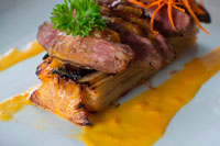 One of the popular dishes of the restaurant Villa Angelique: Magret de canard et son gratin de patate douce et sa sauce "worth casting". 16 euros. Prepared by Chef Yves Atelin. Ingredients: (for 2 people). Duck with sweet potato and pineapple. 1 duck 1 ginger root 4 c soy sauce 2 c s s honey salt and pepper Preparation: Trim the fat side of the breast to form diamonds (can cook faster) Salt and pepper to duck pulpit. Mix the honey and soy sauce and marinate the duck for 2 hours after these two hours, peel and grate the ginger root, then add to the marinade (impregnation and chest). Allow at least 30 minutes in the refrigerator. Bake for about 7 minutes position grill fat side and side chair 5min. Cut the duck and pour the hot marinade. Recipe Sweet Potato Gratin Ingredients: (for 2 people) 300g sweet potato 1 egg 50 ml cream 150ml milk 1 c c nutmeg 1 onion, chopped 1 clove garlic Preparation: Saute onion in a skillet 3 min. Mix the cream, milk, egg, cooked onion, a clove of minced garlic, nutmeg, salt and pepper. Add the grated sweet potato Place