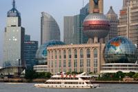 Pudong Skyline, Shanghai, China. Skyline of Pudong as seen from the Bund, with landmark Oriental Pearl tower and Jin Mao tower, Shanghai, China. The word "bund" means an embankment or an embanked quay. The word comes from the Persian word band, through Hindustani, meaning an embankment, levee or dam (a cognate of English terms "bind", "bond" and "band", and the German word "Bund", etc.). It is thus named after the bunds/levees in Baghdad along the Tigris, when the Baghdadi Jews such as the prominent Sassoon family settled their business in Shanghai in the 19th century and built heavily on the bund on the Huangpo. In these Chinese port cities, the English term came to mean, especially, the embanked quay along the shore. In English, "Bund" is pronounced to rhyme with "fund". There are n