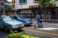 Taxis and mc Donalds restaurant in Shanghai. McDonald's Corporation is facing a shortage of products in some outlets across northern and central China as a result of a shift away from a Shanghai supplier that allegedly sold expired meat to some fast-food chains in the country.  McDonald's outlets in Beijing and Shanghai don't have hamburgers or chicken and the restaurants are encouraging customers to purchase fish sandwiches.