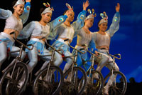 Acrobat bicycle performance Shanghai Centre Shanghai China. Shanghai Centre. Shanghai Zaji Tuan. Inside of a Shanghai troupe of magic and acrobatics, (Shanghai Shangcheng). Centre Theatre. Shanghai Acrobatic Troupe. Shanghai Acrobatic Troupe is the oldest acrobatic troupe in Shanghai and well known around the world. After animal acts were banned at the Shanghai Circus World, the troupe moved to the luxurious Shanghai Centre Theatre in 2005.  This experienced group has skillfully managed to bring together a show that has it all. While maintaining a traditional flavor, the performance is modern with extreme feats to keep you at the edge of your seat. The story is captivating and even the audience can take part!