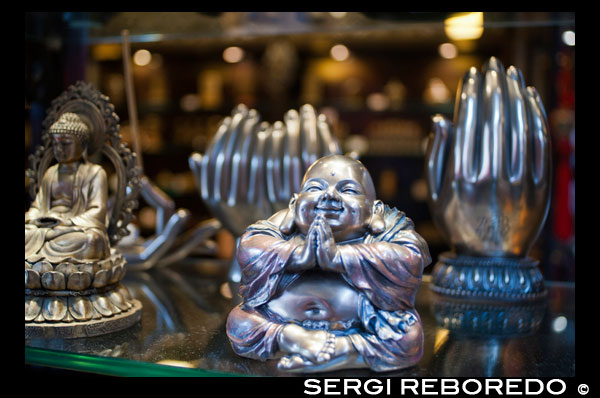 Silver buddha souvenir and hand seller in the shops of Old Town, Shanghai. Jing'an Temple is a famous Esoteric Buddhist temple in the city of Shanghai, peacefully located amidst busy streets just as its name implies (Jing'an means peace and quiet in Chinese). The old-famed Jing'an District just named after the temple. According to the story, Jing'an Temple was first built by Wu State (222-280) at north of Wusong River (also called Suzhou River) in 247 during the Three Kingdom period (220-265). Originally named as Chongyuan Temple, the temple renamed as Jing’an in 1008 in Northern Song Dynasty (960-1127). To protect from the flood of the nearby river, Jing'an Temple was moved to present site in 1216, Southern Song Dynasty (1127-1279). Reconstructed and repaired many times in the history, the existing architecture of the temple was mainly built during the reign of Emperor Guangxu (1875-1908) in Qing Dynasty (1636-1911). The latest reconstruction of Mahavira Hall was completed in 1991, with a Sakyamuni Statue enshrined and worshiped inside, which was made of pure jade and transferred from Burma. It has a height of 3.87 meter, a width of 2.6 meter and a weight of 11,000 kilograms, regarded as the biggest jade Buddha in mainland of China at present. The jade statue was so big that a wall was torn down to hold it. The statue was made according to the style of traditional Buddhist of Han Nationality that the face was shaped like a full moon and the expression was tender and serene. In 2009, an additional silver statue of Tathagata weight in 15 tons also placed in the temple.